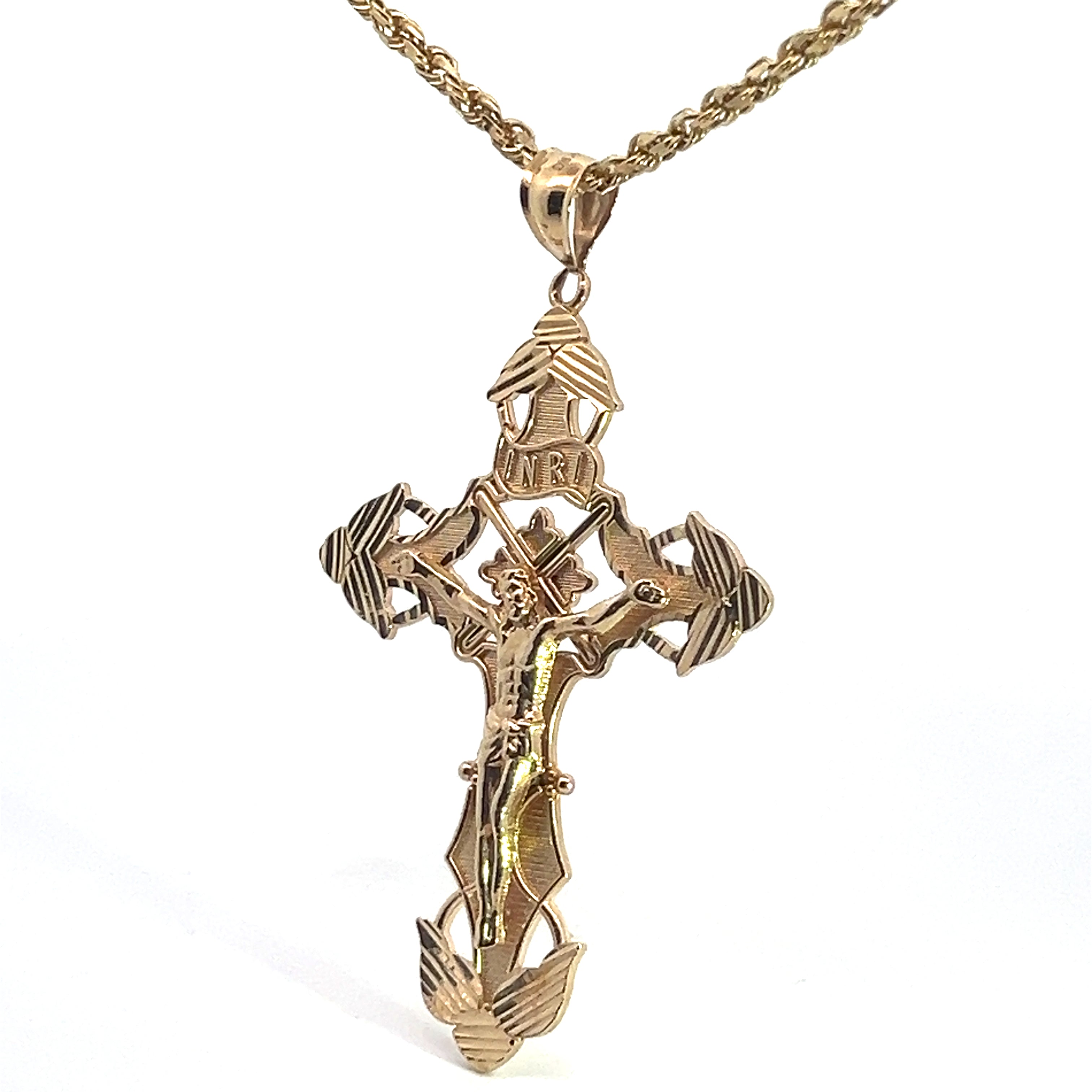 The Late Century 14ktyg Cross on 24 Inch Chain features a gold crucifix pendant with an ornate design and a figure of Jesus Christ on the cross. The top of the cross displays the letters "INRI," and the edges and base are adorned with decorative patterns. The intricately braided chain completes this elegant piece.