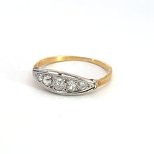 Load image into Gallery viewer, This Edwardian Platinum &amp; 18kt Yellow Gold .50cttw Old Mine Cut Diamond Ring features a row of five small, round-cut diamonds set in a white accent on the top half. The band is thin and elegantly designed, showcasing the sparkling gemstones. Its craftsmanship gleams against a plain white background, highlighting each exquisite detail.