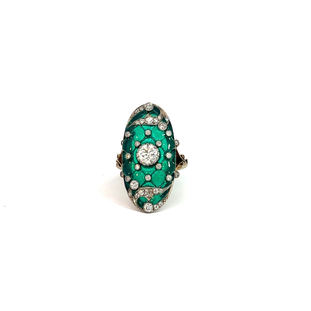 An Art Deco ring showcasing a striking combination of a vivid green enamel centerpiece surrounded by numerous small round Old Mine cut diamonds totaling 1.90 carats, set in an intricate blend of platinum and 18kt yellow gold. The .75-carat diamonds add unparalleled sparkle to the ornate and elegant design, enhancing the bold color contrast created by the green enamel.