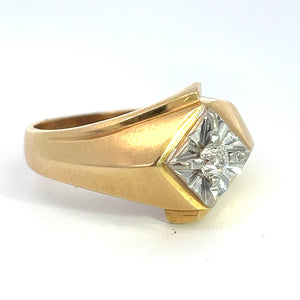 Introducing the Late Century 14kt Two Tone Gold .25ct Old Mine Cut Diamond Ring! This stunning piece showcases an angular design with a distinctive square setting. At its heart lies a central Old Mine Cut diamond, encircled by intricate metalwork that evokes a starburst pattern. The ring features a thick shank that tapers subtly as it wraps around the finger, exuding timeless vintage charm.