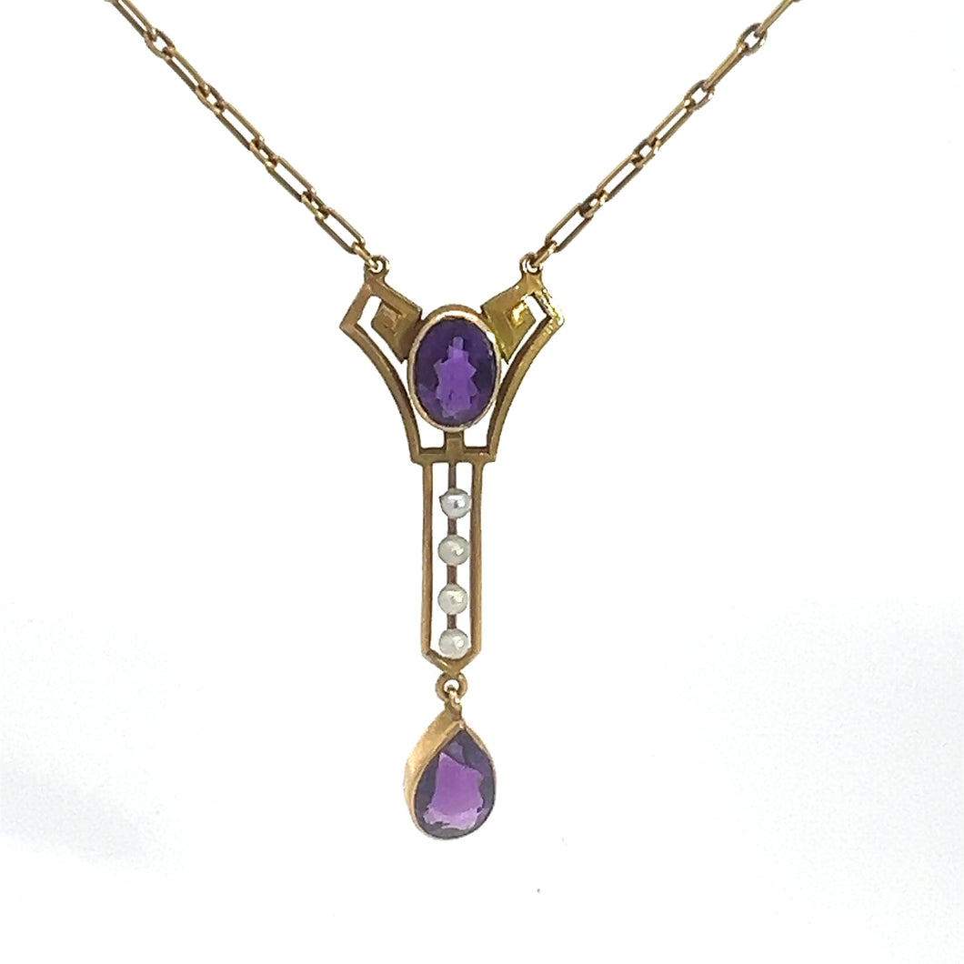 Adorn yourself with the Victorian 14kt Yellow Gold 3.50cttw Amethyst Pearl Lavalier Necklace, showcasing a top amethyst gemstone set in a stylized geometric design. Below it hangs a vertical bar adorned with three small pearls, culminating in another teardrop-shaped amethyst gemstone. This exquisite piece exudes timeless elegance.