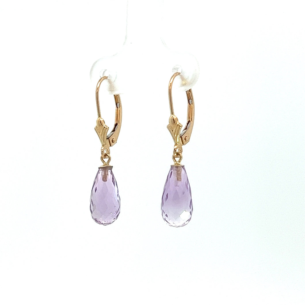 Introducing our Modern 14kt Yellow Gold Amethyst Briolette Cut Dangle Earrings, featuring teardrop-shaped lavender gemstones and lever-back clasps. These exquisite earrings are showcased against a white background.