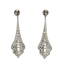 Load image into Gallery viewer, The Art Deco Platinum 8cttw Old Mine Cut &amp; Antique Cut Diamond Drop Earrings showcase an intricate design with multiple small round clear gemstones surrounding a larger central gemstone. These earrings gracefully hang from a small stud at the top and taper down to a pointed tip.