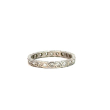 Load image into Gallery viewer, The Art Deco Platinum .50cttw Antique Cut Diamond Eternity Band showcases a slender, platinum band adorned with antique cut diamonds arranged in an unending design. This vintage-inspired masterpiece is elegantly presented at an angle against a white background, accentuating its sophisticated appearance.