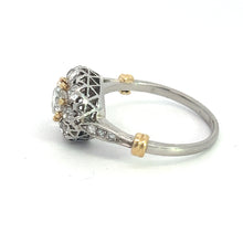 Load image into Gallery viewer, The Edwardian Platinum &amp; 18kt Yellow Gold 1.30cttw Old Mine Cut Diamond Ring features a stunning silver lattice-style head adorned with old mine cut diamonds. The band is elegantly crafted from platinum and 18kt yellow gold, with gold accents near the head, showcasing a larger round diamond in the central setting against a plain white background.