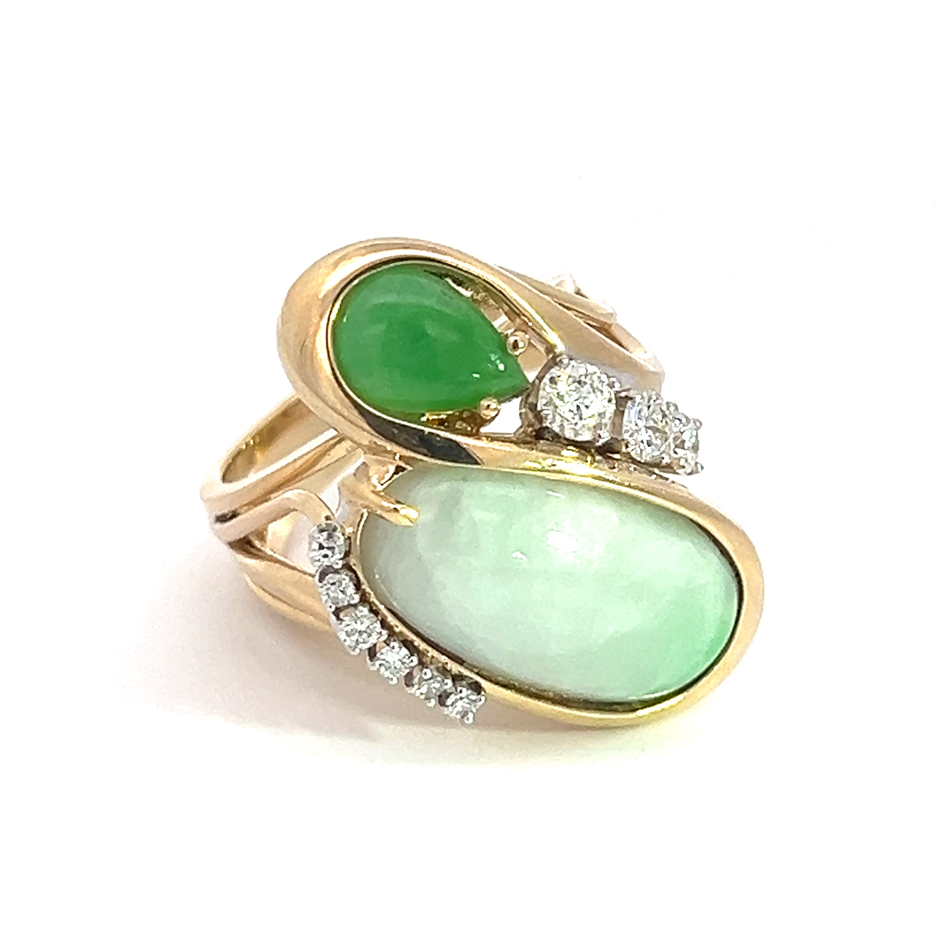 The Late Century 14kt Yellow Gold Jade + .60cttw Diamond Cocktail Ring showcases two striking jade stones—one pear-shaped and one oval—complemented by small, round diamonds elegantly set around the larger stone. An intricately twisted band adds a touch of sophistication to this beautifully designed piece.